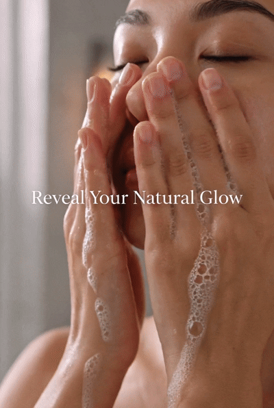 Hammam Skin turmeric and kojic acid soap bar lathered on a woman's face for a radiant and bright complexion