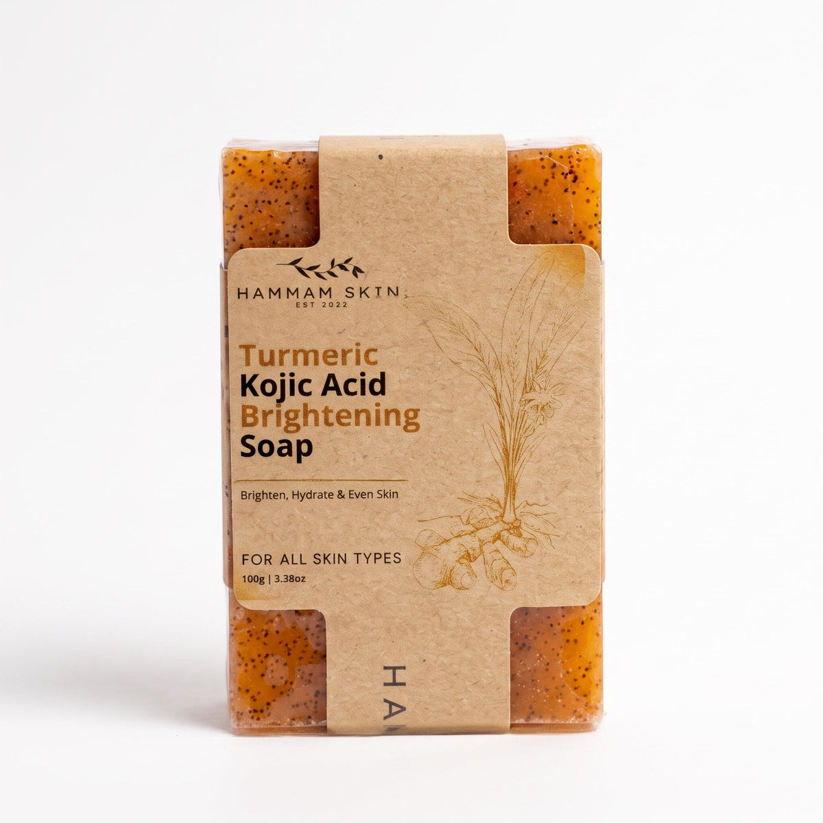 Hammam Skin turmeric and kojic acid brightening soap bar in eco-friendly paper packaging on a white background